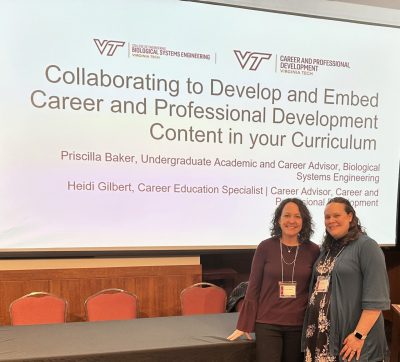 Facilitators standing in front of screen