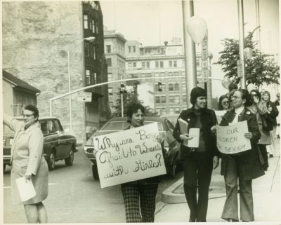 archive photo of people protesting women's rights in the 1970s