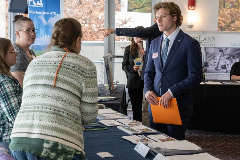 Virginia Tech student engaging with industry professionals at the 2022 Agricultural and Applied Economics Career Fair. Photo by Clark DeHart for Virginia Tech.